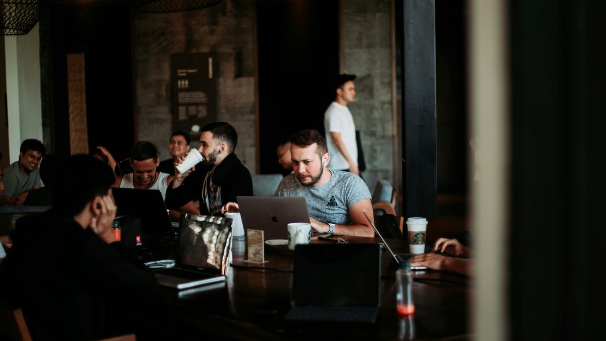 People in a meeting room discussing AI opportunities for their business